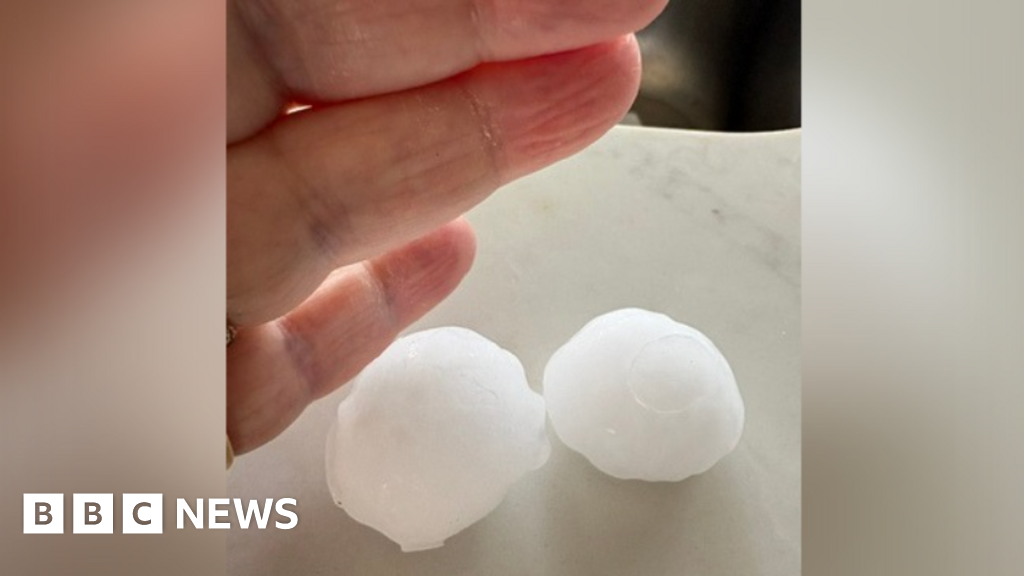'Golf ball-sized' hailstones damage roofs and cars
