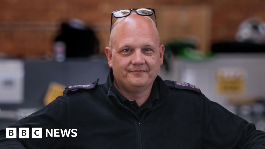 Officer who pulled driver from burning car honoured