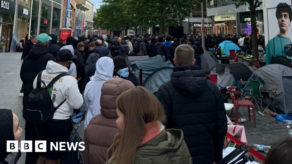 Massive queues shut Swatch stores as hundreds clamour for £335 limited edition watch