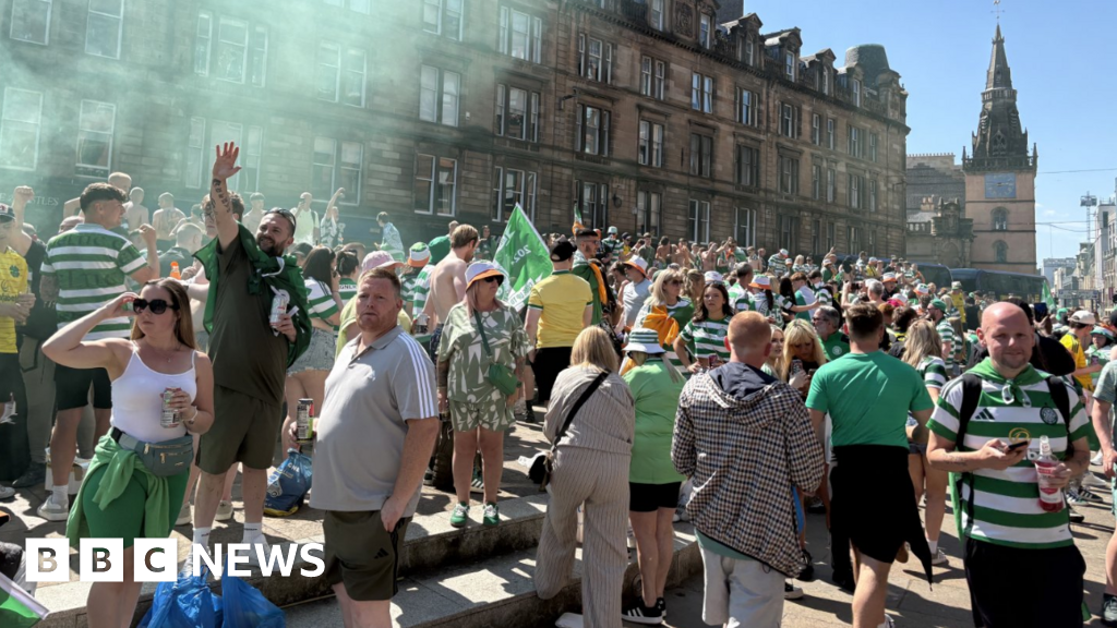 Jubilant Celtic fans celebrate after  Hearts' title dreams are dashed